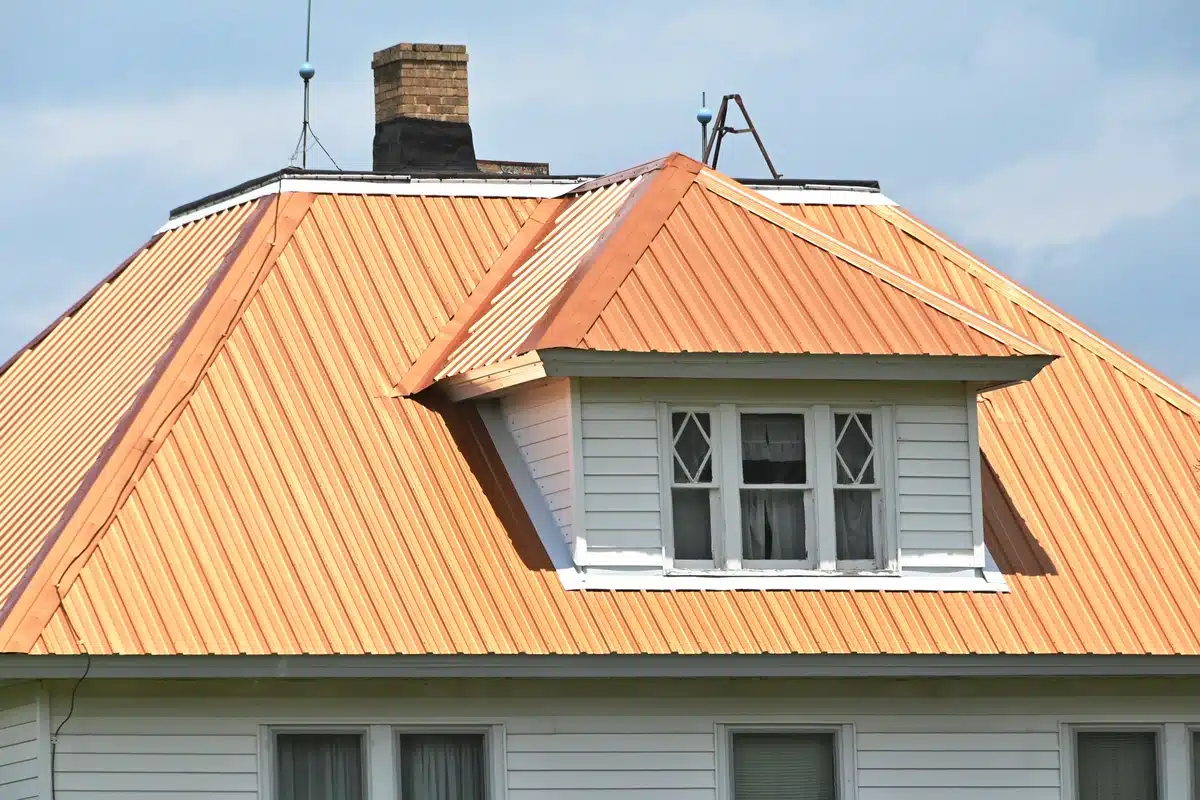 copper roof of a house with window