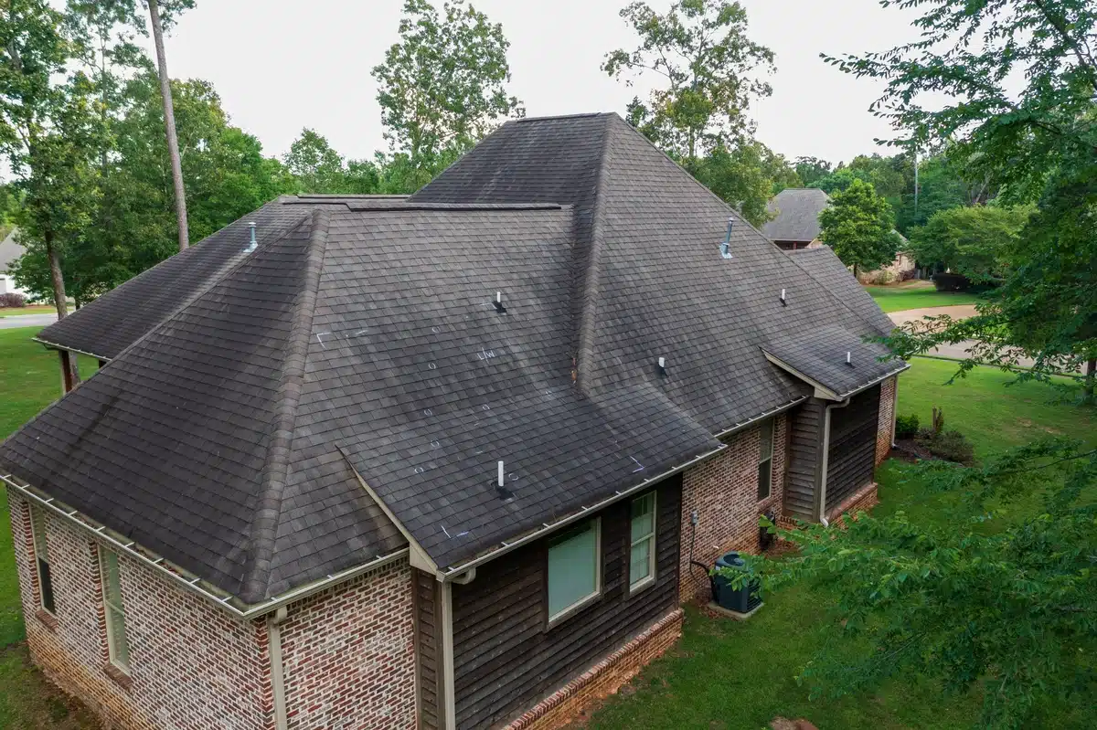aged house roof with hail damage marks