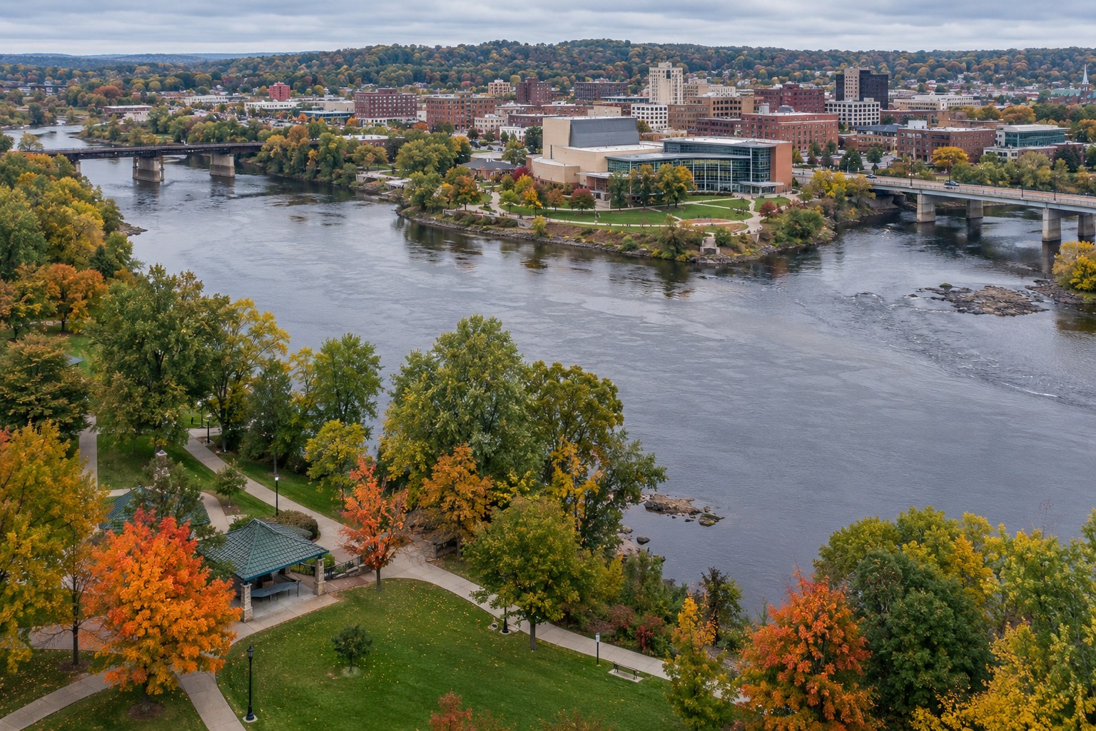 AI-generated downtown Eau Claire at the river confluence in autumn