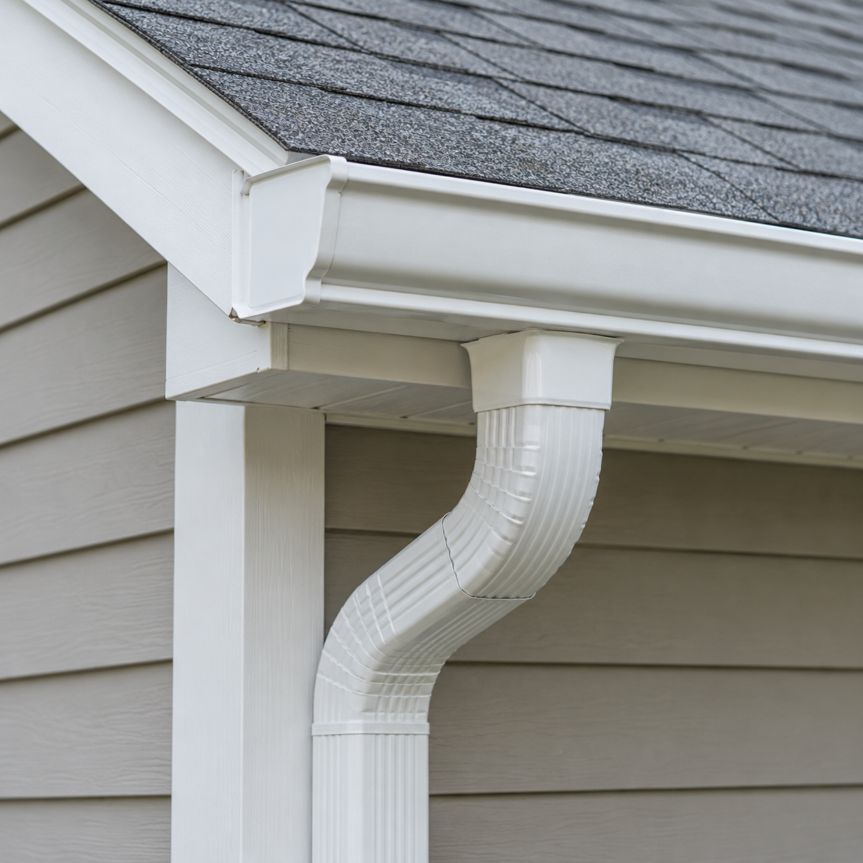 White gutter and downspout at a house eave (AI-generated illustration)