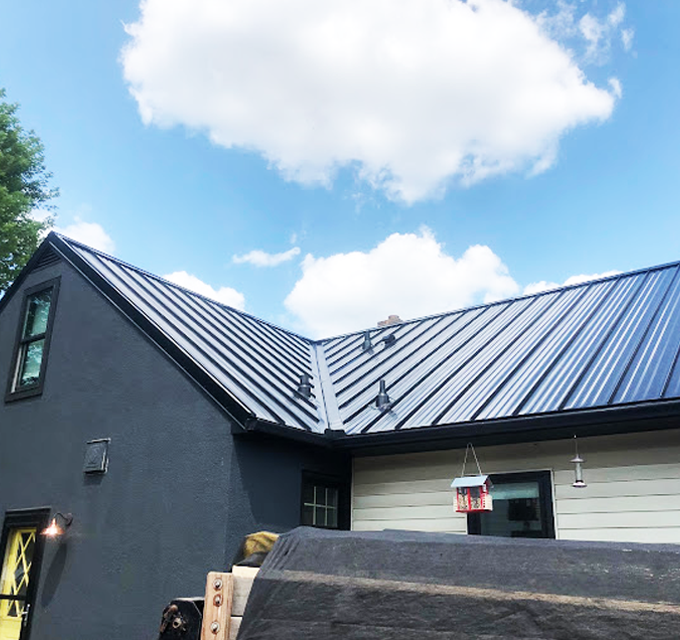 Completed standing-seam metal roof by Level Edge Construction