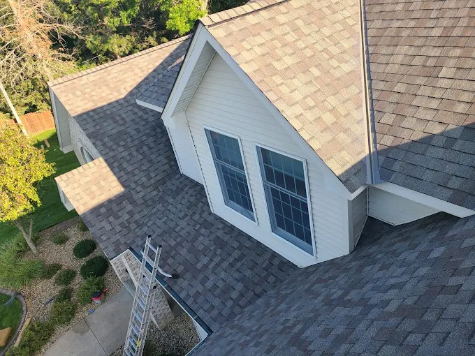 White-sided dormer with paired windows and coordinated roofline